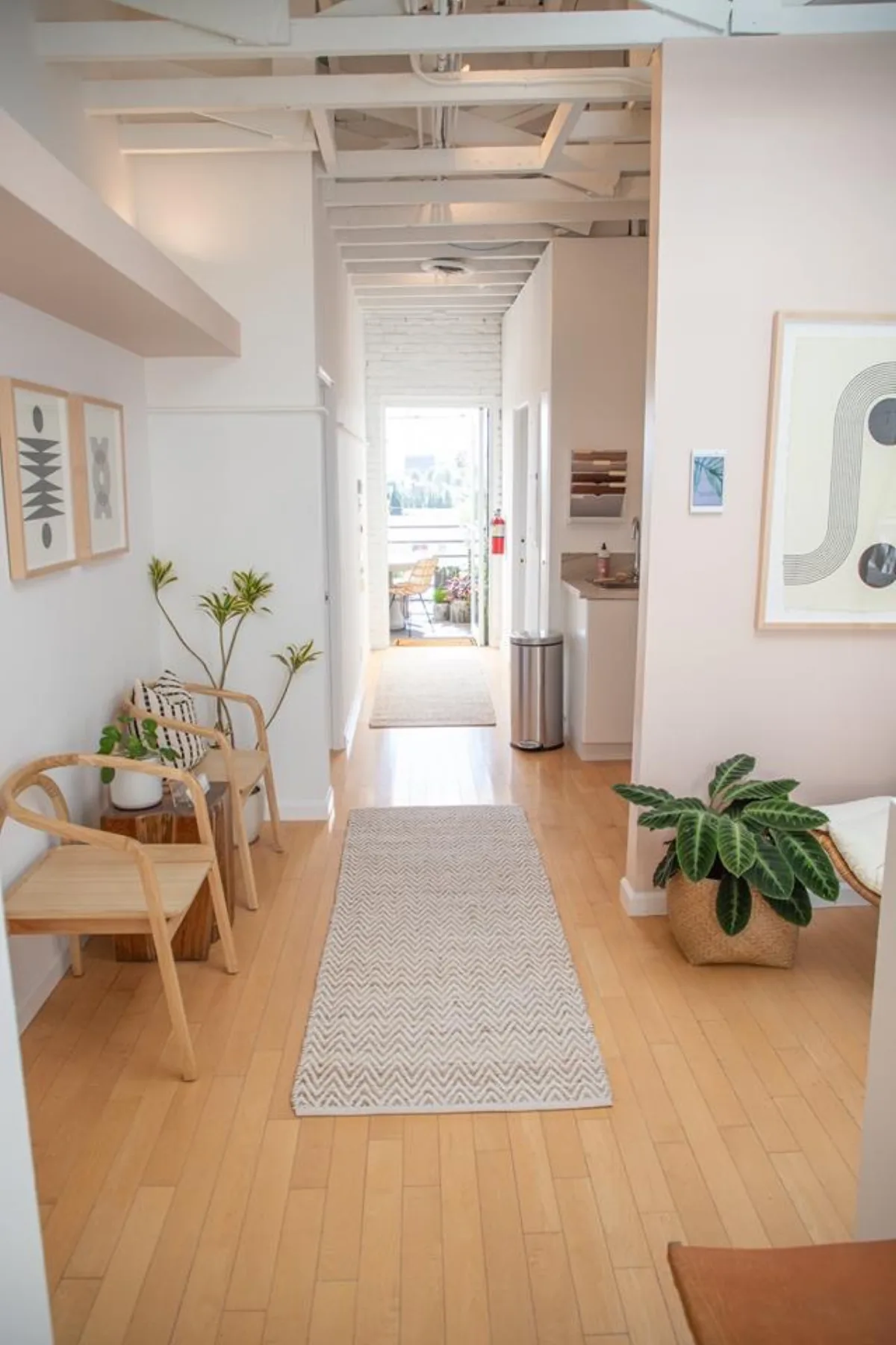 The light-filled hallway leading to the therapy room